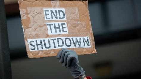A protest against the government shutdown, highlighting the impact on federal workers and essential services.